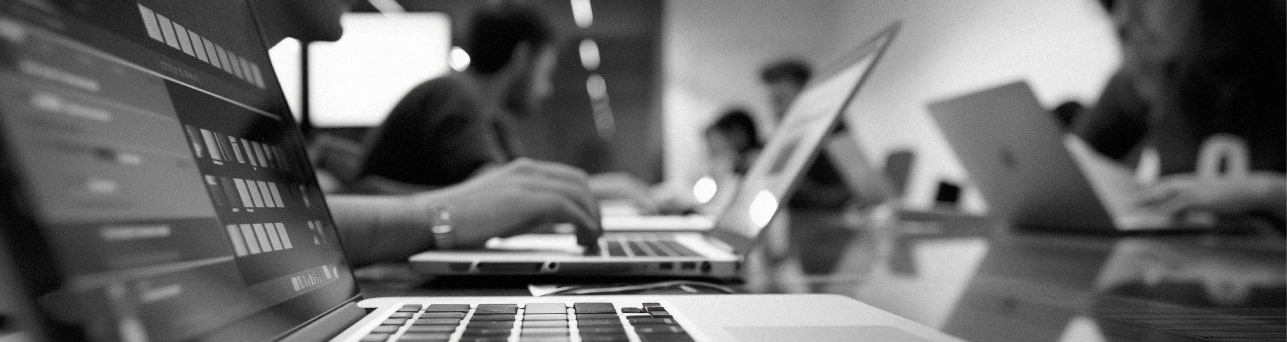 ERP implementation team collaborating in a technology-driven workspace